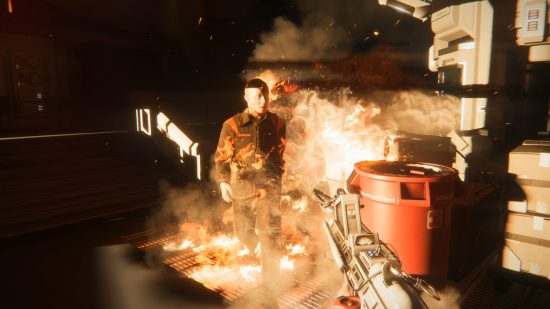 Best PC games - Alien Isolation: The player firing a flamethrower at an android