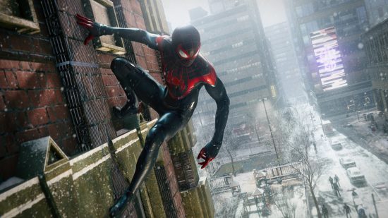 Best PC games - Marvel's Spider-Man: Miles Morales: Miles hanging from the side of a building in the snow