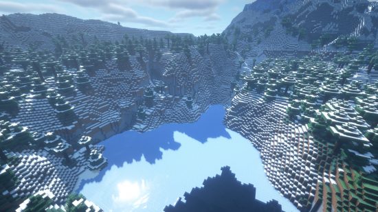 Minecraft Christmas seeds - 5488656216511509290: sun rays pour over snow-topped mountains and a frozen lake.